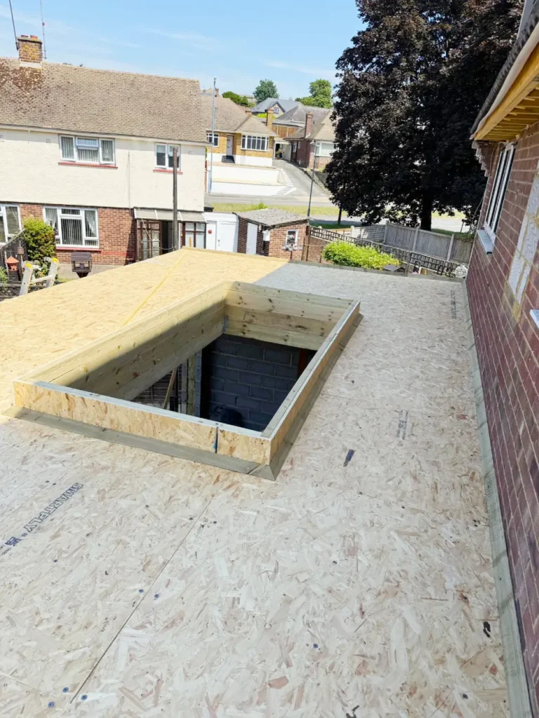 Timber roof structure completed and ready for waterproofing.