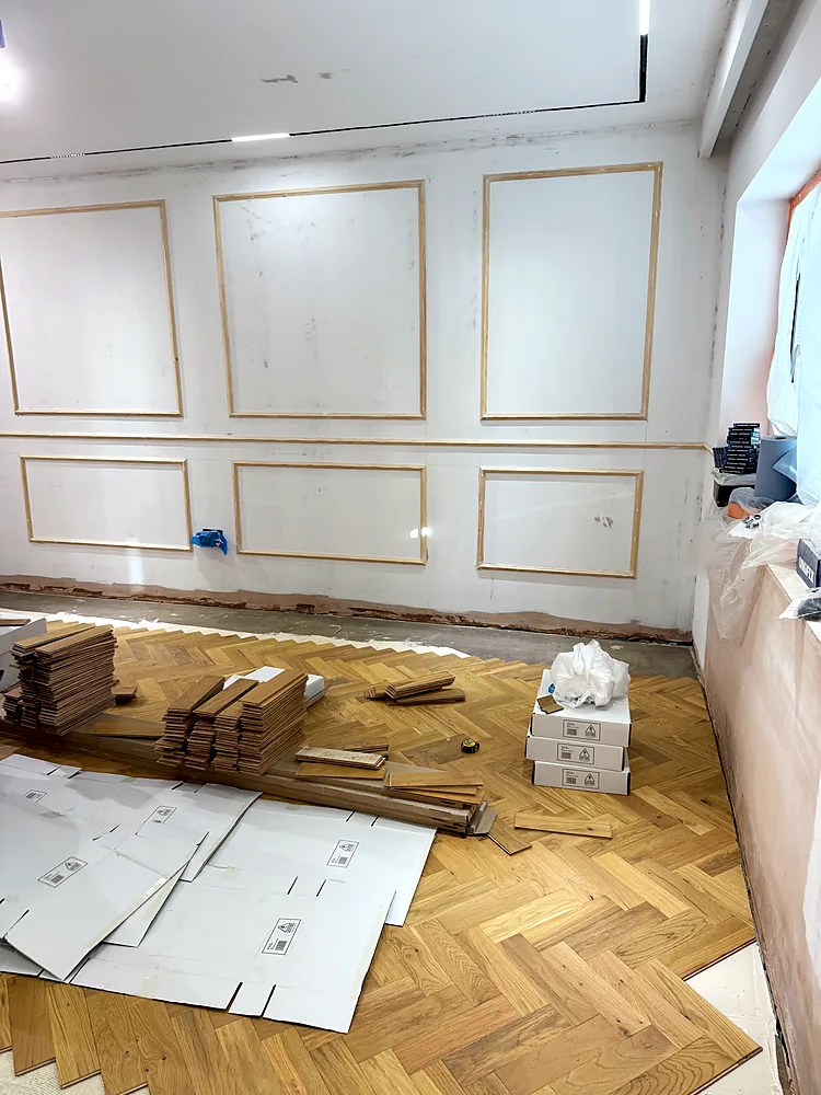 Herringbone oak parquet laying panelled room