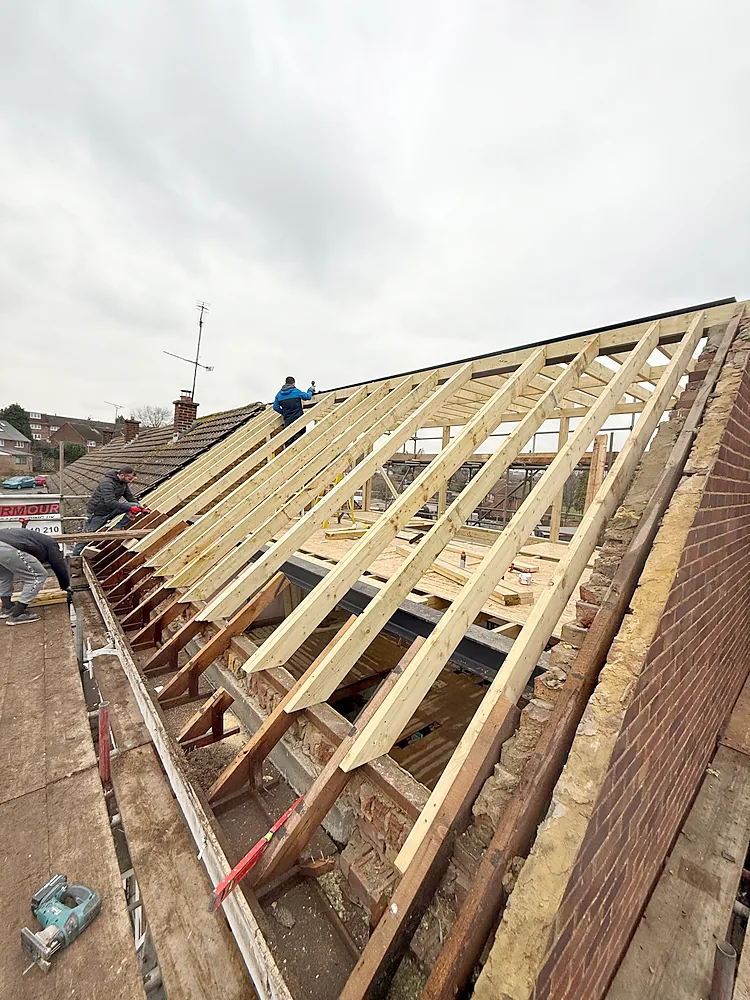 Hip to gable loft new rafters on gable wall