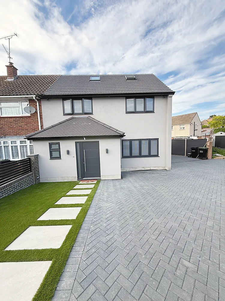 House frontage herringbone block paving and lawn