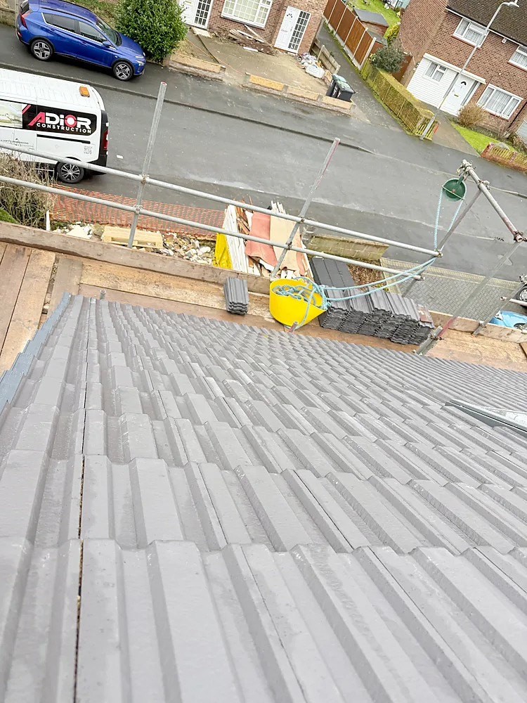 New roof tiles scaffolding and Adior van