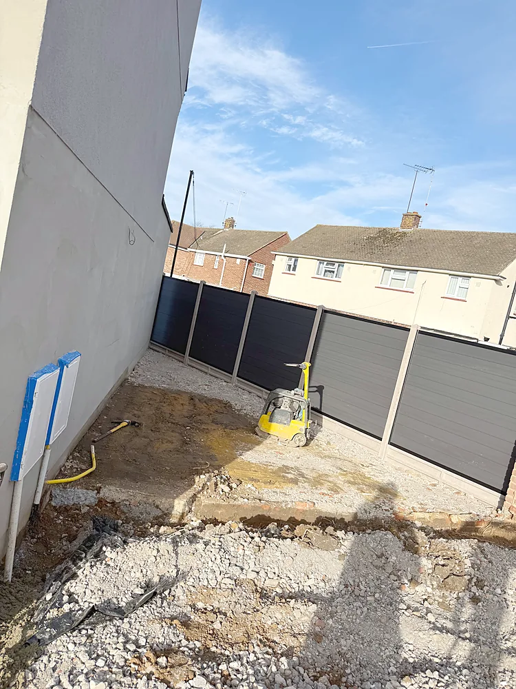 Side return composite fence and compactor